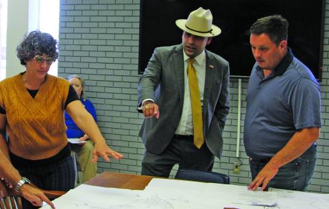 Sentinel Photo/Mike Reddell Bold Fox Development Managing Shareholder Alex Kamkar, center, explains subdivision plat to Planning Commissioners Zeinab Ghais, left, and Josh Fortenberry.