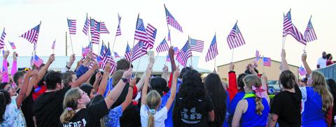 Tidehaven students make a great red, white and blue statement to observe the anniversary of 9/11. The profusion of flags and the Tiger football team’s display of much larger American flags all struck the appropriate tone of unity. Sentinel Photo/ Jessica Shepard