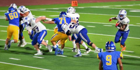 Photo/Dee Sneath Tiger running Joseph Dodds (5) gets an early opening for his run against Odem.