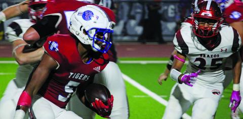 Sentinel Photo/Mike Reddell Tiger junior running back Joseph Dodds (5) looks for yardage  - en route to a 163-yard rushing game against Brazos last Friday.