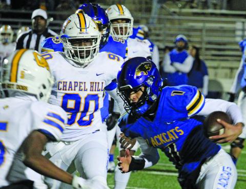 Sentinel Photo/Mike Reddell Blackcat quarterback Alex Estrada (1) picks up some tough yardage deep in Chapel Hill territory Friday night at Humble.