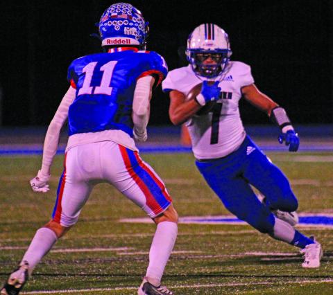 Anna Hernandez photo Tidehaven’s Chance McRae (7) works to get around a Nixon-Smiley defender in the Tigers winning area playoff game at Rice Consolidated last Friday, Nov. 18.