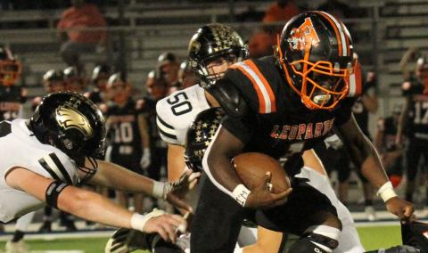 Photo/Anna Hernandez Van Vleck’s Cam Austin (1) does everything to get though Rogers defense line and stays on his feet to gain a few yards.
