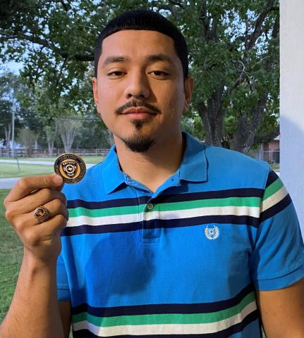 BCPD photo Corporal Jose Soto shows off Chief’s Challenge Coin.