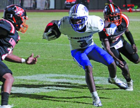 Sentinel Photo/Mike Reddell Tidehaven’s T’Shaun Davis looks for an opening against Van Vleck.