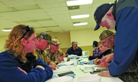 Sentinel Photo/Jessica Shepard Birders finalize their count sheets before the preliminary tally total at the Annual Audubon Matagorda County Mad Island Marsh Christmas Bird Count (CBC) Monday, Dec. 19. 