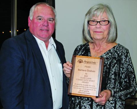 Photo by Mike Reddell Mitch Thames presents Tiger Lane Award to Barbara Graham