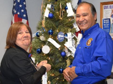 Crime Victim Liaison Lettie Ramos and Police Chaplain Joe Ramos are shown putting ornaments on Bay City Police Department’s Angel Tree. BCPD’s Victim Services held the Tree of Angels Ceremony honoring the victims of crime who are no longer with us on Thursday, Dec. 1. BCPD photo