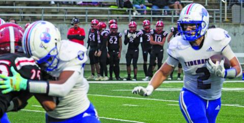 Sentinel Photo/Mike Reddell Tidehaven’s Jachen Duran (2) follows a block from running back Joseph Dodds (5) against Brazos defenders, as the Tigers take the regional playoff title at Rosharon’s Freedom Field last Friday.