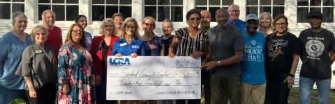 LCRA Photo LCRA representatives present a $25,000 grant to the Sanford Community Center for an exercise and birding trail.