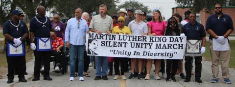 Sentinel Photo/Mike Reddell Participants in the Martin Luther King Day Silent Unity March prepare to step off from the old Linnie Roberts Elementary parking lot Monday, March 16. The event drew marchers estimated in the 40s.