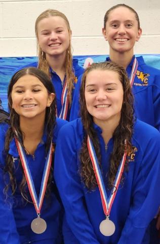Photo by Clare Button Bay City Swim Team freestyle relay from last week’s regional meet includes: front – Kaydence Sanchez and Victoria Sliva, and back – Lucie Frick and Megan Moya)