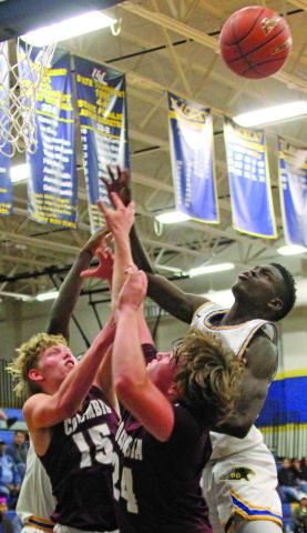 Photo by Anna Hernandez A Blackcat reaches higher than Columbia defenders in this recent game. Bay City won 55-47 over Columbia. Bay City stands 6-17, 2-6 on the season.