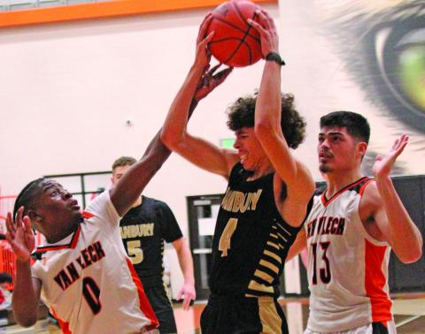 Photo by Anna Hernandez Leopards Corey Austin (0) and Peyton Huerta (13) surround a Danbury player trying to get a pass off.