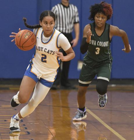 Larry Bose photo Ladycat sophomore point guard Alaysia Cook (2) hurries down court in a Jan. 25 contest against Iowa Colony that the girls won 58-38. The Ladycats have clinched the District 26-4A-1 crown and claim a 27-1, 11-0 record.