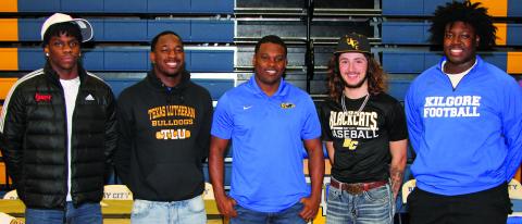 Sentinel photo/Mike Reddell Four Blackcat athletes signed college commitments at Bay City High School’s signing day celebration at the gym Feb. 1. The four - shown with Head Football Coach Robert Jones (center) - includes, from left: Brice Turner - football at the University of Nebraska; Josh Williams - football at Texas Lutheran University; Ashton Wallace - baseball at Arlington Baptist University; and Zo'maryon Bryan - football at Kilgore College.