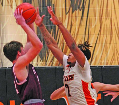 Photo by Anna Hernandez Leopard forward Keemer Allums (2) puts a strong defense on an East Bernard shooter.