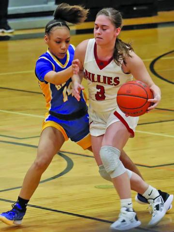Courtesy photo Ladycat junior guard Madison Thrift (14) moves to slow down a Fredericksburg Billie player in the UIL state tournament area round last week. The girls lost 66-31, after winning the bi-district title. The Ladycats under Coach Chandi Jones finish the season with a 29-2 season mark and 12-0 and first in District 26-4A-1.