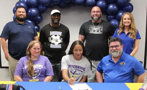Sentinel Photo/Mike Reddell Bay City Lady Cat Ella Mata-Perez, center, signed with the Concordia University soccer team at BCHS ceremonies last week. Shown with Mata-Perez on front row is her mom, Vickie Perez, and her Soccer Coach Darin Dabelgott. In the back are, from left: Recreation Coach 6th grade through current Joe Villalovos; Conditioning Coach Squeaky Brinkley, Assistant Coach Will Cook, and High School Assistant Coach Tara Castro.