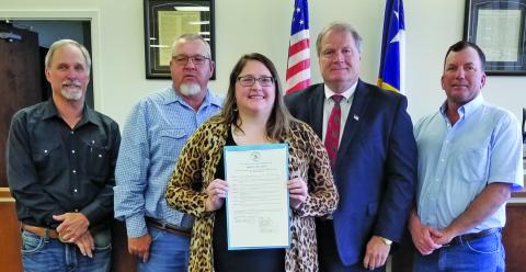 Sentinel Photo/Mike Reddell Commissioners Court approved a proclamation recognizing April 23 - 29, as National Library Week at the court’s meeting Monday, April 17. Shown are, from left: Precinct 1 Commissioner Bubba Cook, Precinct 4 Commissioner Bubba Frick, Bay City Library Director Samantha Denbow, County Judge Bobby Seiferman, and Precinct 2 Commissioner Mike Estlinbaum.