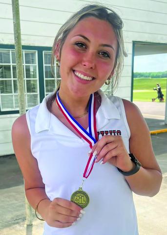 Contributed photo Van Vleck golfer Karly Brown shows off the medal she received in qualifying for regional competition.