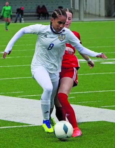 Sentinel Photo/Mike Reddell Bay City Lady Cats Soccer player Alaysia Cook (8) works to get past a Lumberton defender in a UIL regional semi-final game Friday, April 7, at Katy’s Legacy Stadium. The Lady Cats fell to Lumberton 3-0 in a game marked by constant rain. The Lady Cats impressive season, (26-3) included an undefeated sweep of 14 straight shutouts in district.