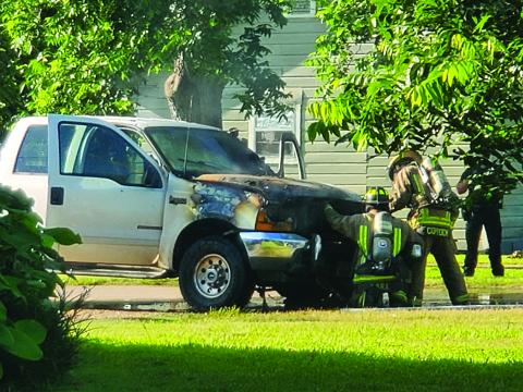 Sentinel photo/MaLinda Reddell Bay City firefighters extinguish a truck fire that Fire Marshal Dan Shook said was blamed on failing to complete a vehicle recall.