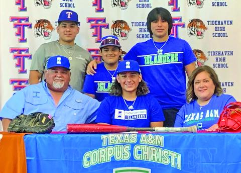 Le'Darion Stone photo Tidehaven’s varsity catcher, Zach Garcia’s signing day picture with his parents and brothers when he recently signed with Texas A&M University Corpus Christi ,to further his education and play baseball. 