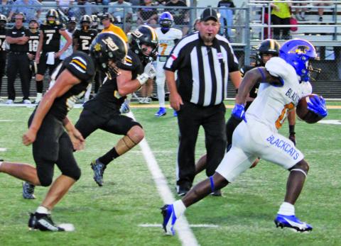Sentinel Photo/Mike Reddell Junior running back Jada Andrews leaves Sealy defenders behind en route for a Blackcat score.