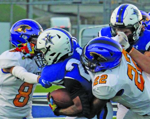 Sentinel Photo/Mike Reddell Senior defensive back Elijah Hernandez (8) and sophomore linebacker James Copeland (22) put a stop to a Navasota running back.