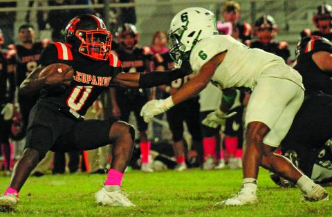 Anna Hernandez Junior Van Vleck running back Corey Austin (0) tries to move past a Boling defender. Austin had a 39-yard touchdown run.