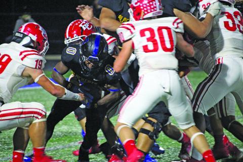 Sentinel Photo/Mike Reddell Junior running back Jada Andrews (0) barrels through the middle of El Campo defenders for yardage. Andrews had a game-high 161 yards rushing.
