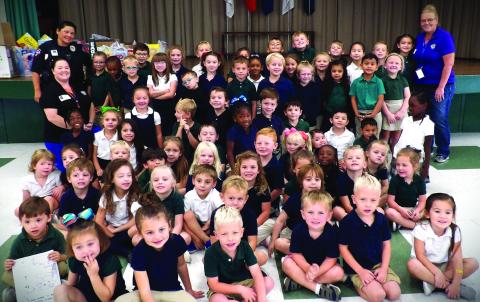 Contributed photo Ginger Iovanna and Lillie Norris with the Bay City Municipal Court visited Holy Cross Catholic School recently, along with Bay City Police Officer Tomasiato. The three ladies taught HCCS students about stranger danger, seatbelt safety, car seat safety, bike safety, and how not to ride in a vehicle when someone is under the influence.