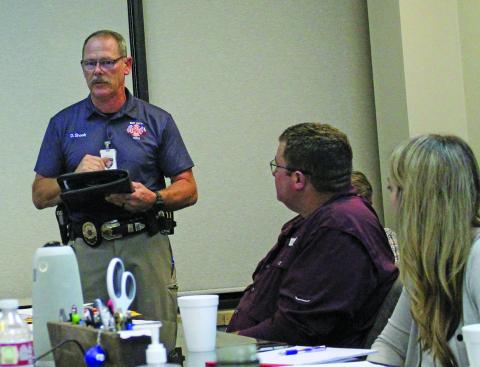 Sentinel Photo/Jessica Shepard Bay City Fire Marshal Dan Shook explains new pager system to the Port of Bay City Authority board, Nov. 9.