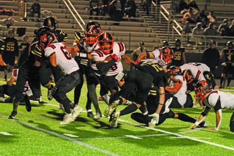 Anna Hernandez photo Van Vleck running back Keemar Allums (8) tries to break through the Rogers’ defense. 