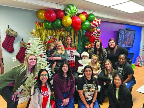 Contributed photo The Crisis Center folks say they consider their resident Christmas party as one of their favorite Christmas traditions - games, presents, food, fun and most importantly Santa.