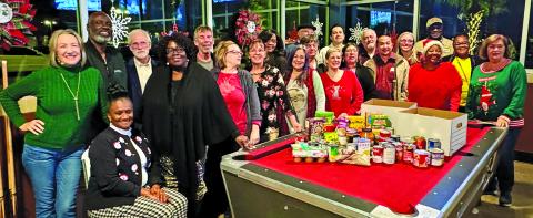Contributed photo The Matagorda County Democratic Party gathered non-perishable food items at their December 11th holiday party. The food was donated to the Harvest House food pantry in Bay City.