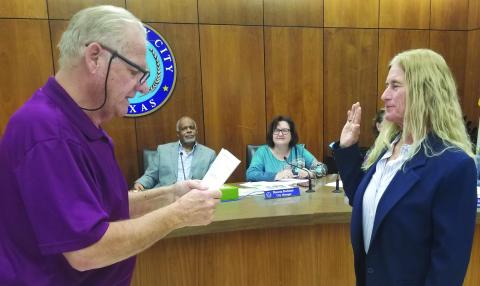 Precinct 2 Justice of the Peace Suzanne Sullivan was sworn in as Associate Municipal Court Judge by longtime Municipal Court Judge Mark Finlay at City Council's regular meeting Dec. 12. Finlay was honored at the meeting for his years of service. Sullivan will replace him as Associate Municipal Court Judge when Finlay retires in January. Sentinel Photo/Mike Reddell
