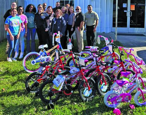 Contributed photo Tender Years Enrichment Center donated bicycles to the PD. The PD donated the bicycles to The Crisis Center. Thank you to everyone involved to make this happen. Featured in pic: Tender Year Enrichment Center employees; Symirra James, Arieanna Selman, Karla Frausto, PD staff and Crisis center employees.