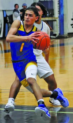 LeDarion Stone/Live in the Moment Photography Above Blackcat Alex Estrada (1) prepares for a layup against Sweeny Jan. 5. Bay City, 4-12,-0-3, fell to the Bulldogs there 59-57 in overtime. Next up for the Blackcats will be LaMarque here Friday, Jan. 12.