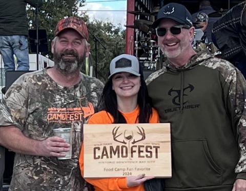 Contribute Photo 2024 Camofest Food Camp Fan Favorite Edward Jones Financial Advisor James Scardami, left is joined by Bay City Main Street Program Manager Tina Iseral, and Robert Knox.
