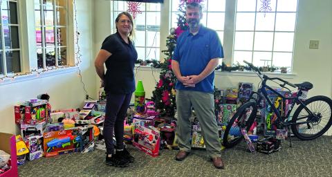 Contributed photo Rio Colorado Golf Course recently donated toys to Toys for Tots, with James Scardami accepting.