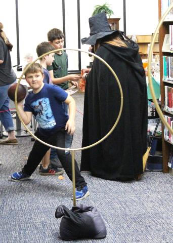 Fans of Harry Potter filled the Bay City Public Library to experience a sample of the wizarding world last week. Attendees were able to pick their own wands, mix a potion to increase their luck, get sorted into their Hogwarts house, and even play Quidditch (left). Sentinel Photo/Jessica Shepard