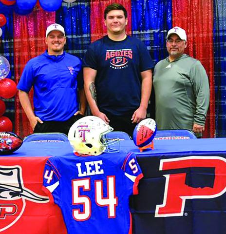 Contributed photo Tidehaven senior defensive tackle Wyatt Lee signed a letter of commitment last week with Oklahoma Panhandle State University in Goodwell, Okla. Wyatt is flanked by Coach Eric Lucio, left, and Head Coach David Lucio.