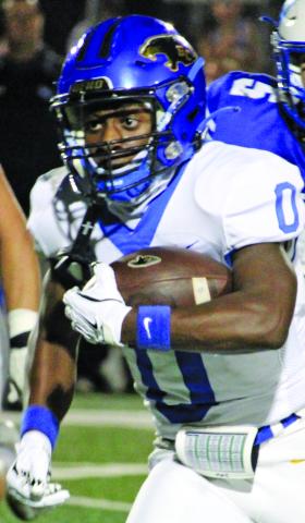 Sentinel Photo/Mike Reddell Bay City’s Jada Andrews (0) picks up yardage against La Vernia Friday. He slashed the Bears’ defense for 124 yards. 