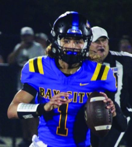 Sentinel Photo/Mike Reddell Blackcat senior quarterback Alex Estrada looks for a receiver, in his 351-yard passing night against Calhoun Friday.