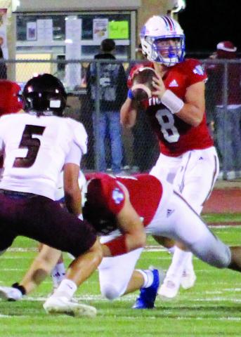 Sentinel Photo/Jessica Shepard Tiger quarterback Kale Russell (8) looks for a receiver.