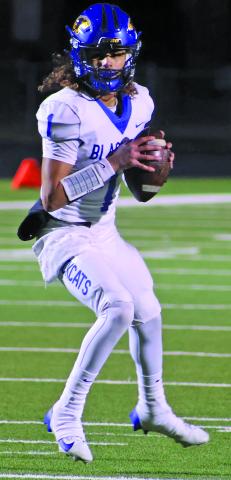 LeDarion Stone/Live in the Moment Photography Quarterback Alex Estrada looks for an open receiver down field.