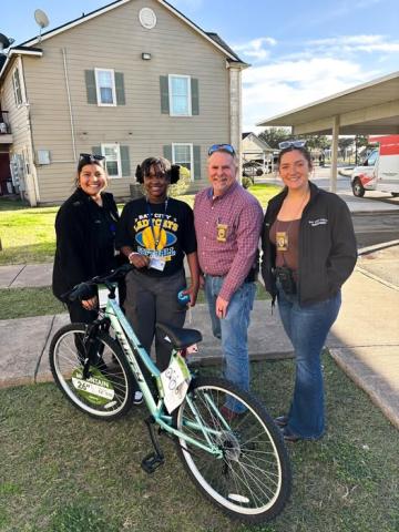 Courtesy photo Shop with a Cop presented this young lady with a brand new bike after they heard her bike was taken and destroyed.