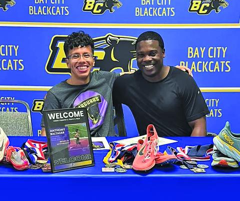 BCHS  photo BCISD Athletic Director Robert Jones, right, celebrated with Blackcat trackster Anthony Baltazar signing with Jacksonville College to compete in Cross Country and Track & Field. 